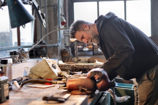 carpenter working hard in the workshop at townsville handyman